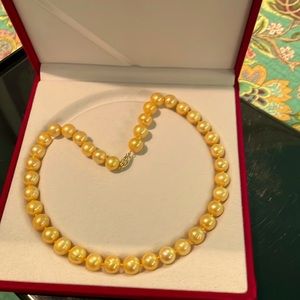 17” freshwater pearl necklace has a rich golden color and a 14k gold clasp